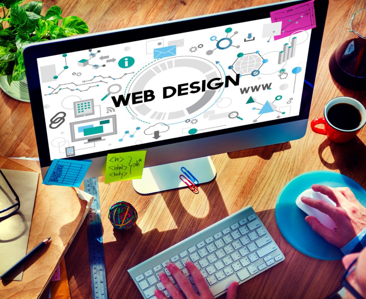 Computer displaying web design concepts