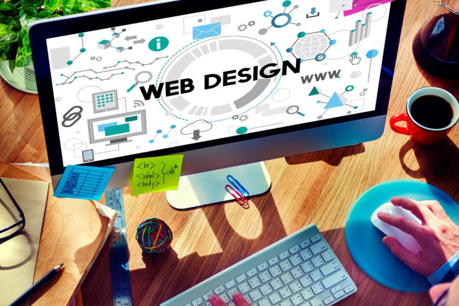 Computer displaying web design concepts