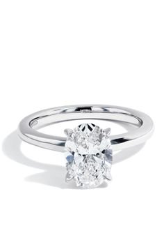 Elegant oval diamond rings offer timeless beauty with a modern twist. Their elongated shape enhances sparkle and creates a flattering, sophisticated look.