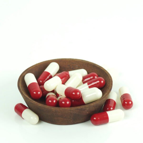 red and white herbal capsules