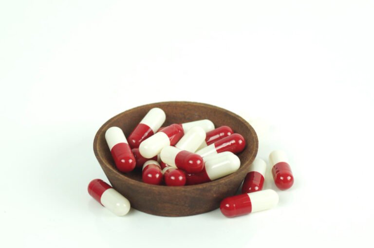 red and white herbal capsules