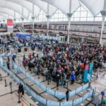 Travelers waiting in line at security checkpoint at Denver International Airport