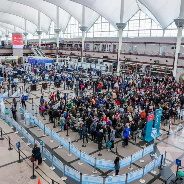 Travelers waiting in line at security checkpoint at Denver International Airport