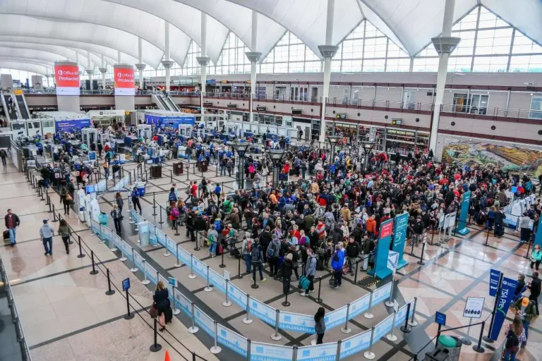 Travelers waiting in line at security checkpoint at Denver International Airport