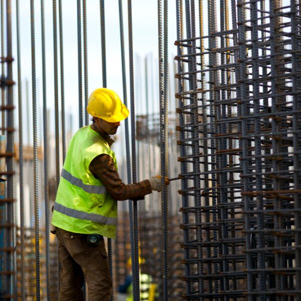 Man i construction site, working.