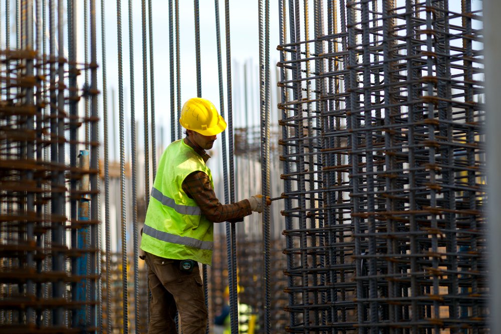 Man i construction site, working.