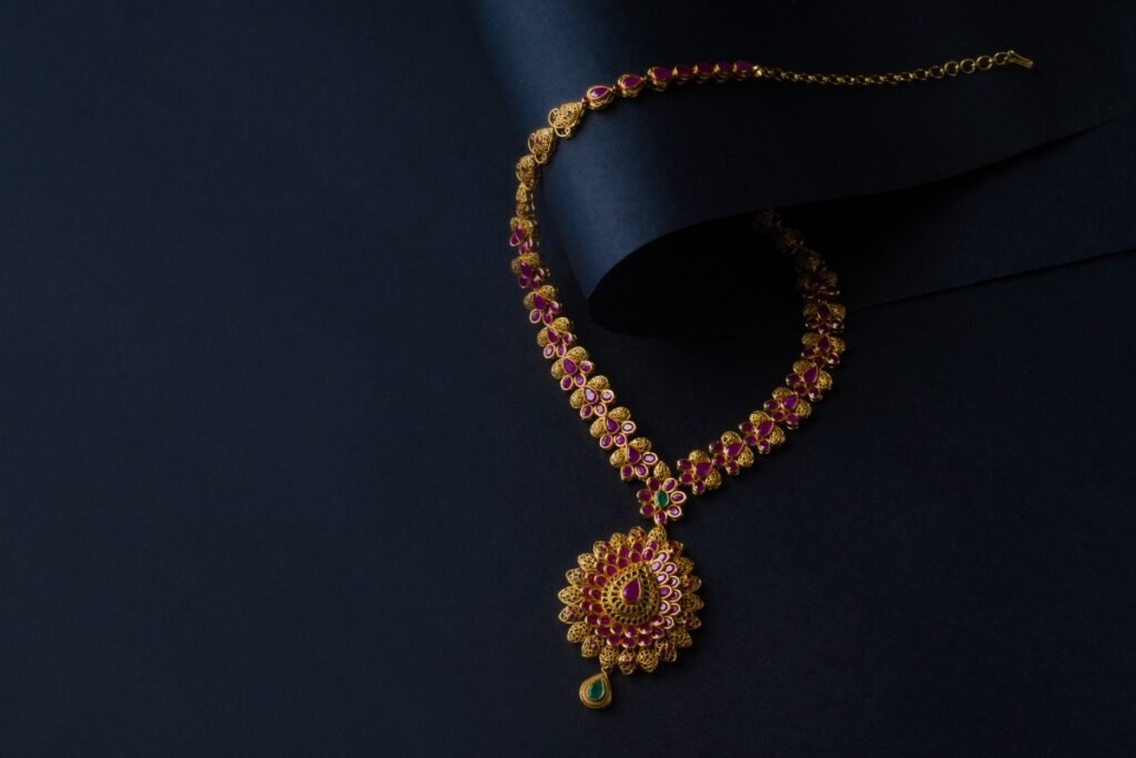 gold necklace on black background